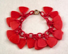 BB271 red bakelite charm bracelet